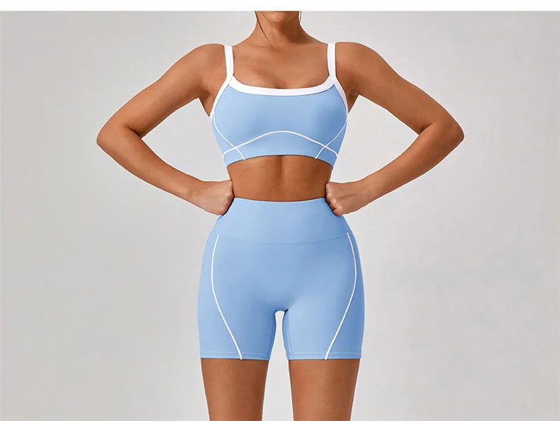 KiKis women's nude fitness shorts set modeled in light blue with white trim and high waist shorts