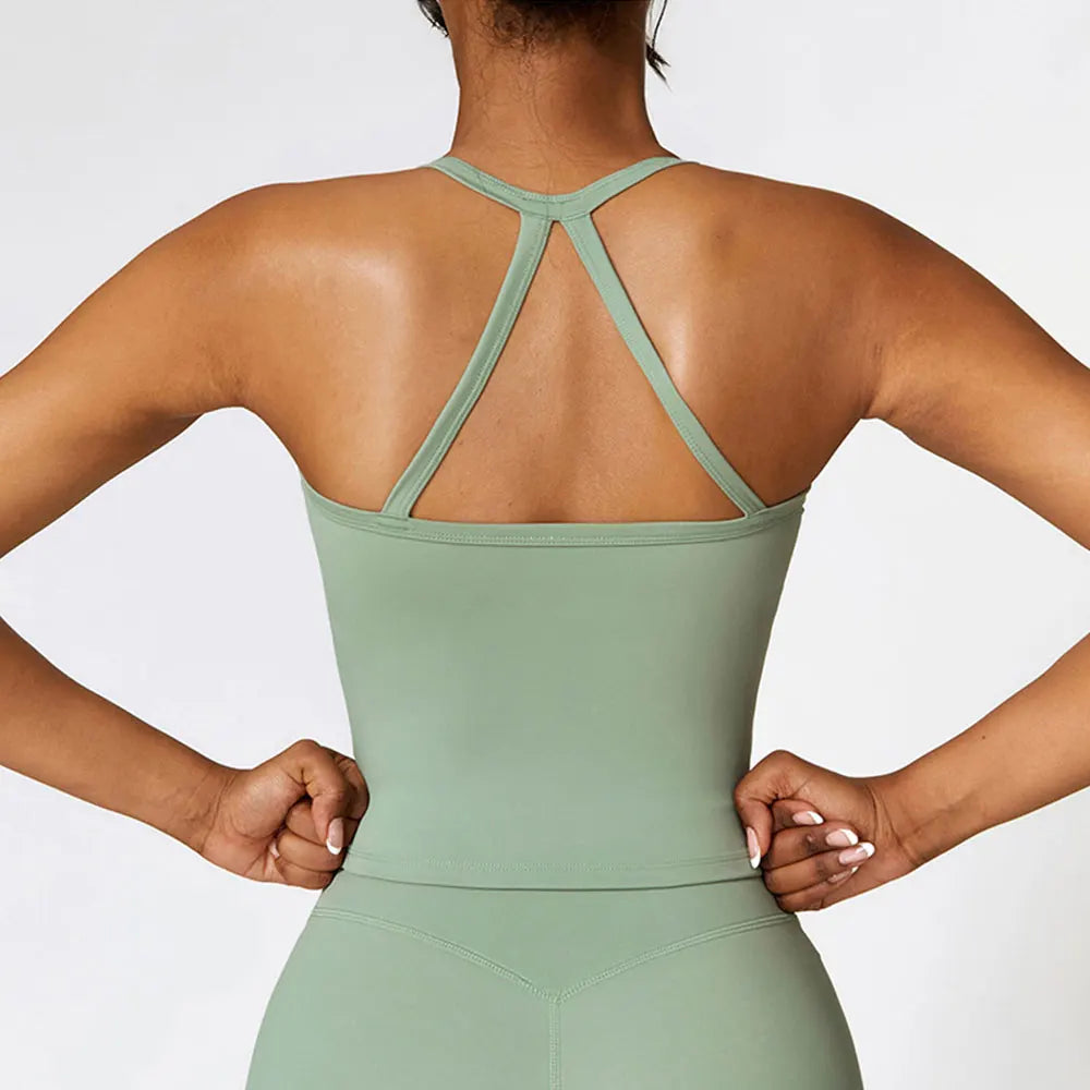 KiKis breathable gym workout bra for women in light green with a stylish strappy back design