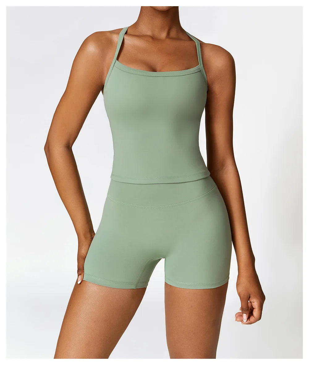 Breathable gym workout bra for women in light green with thin straps and matching shorts
