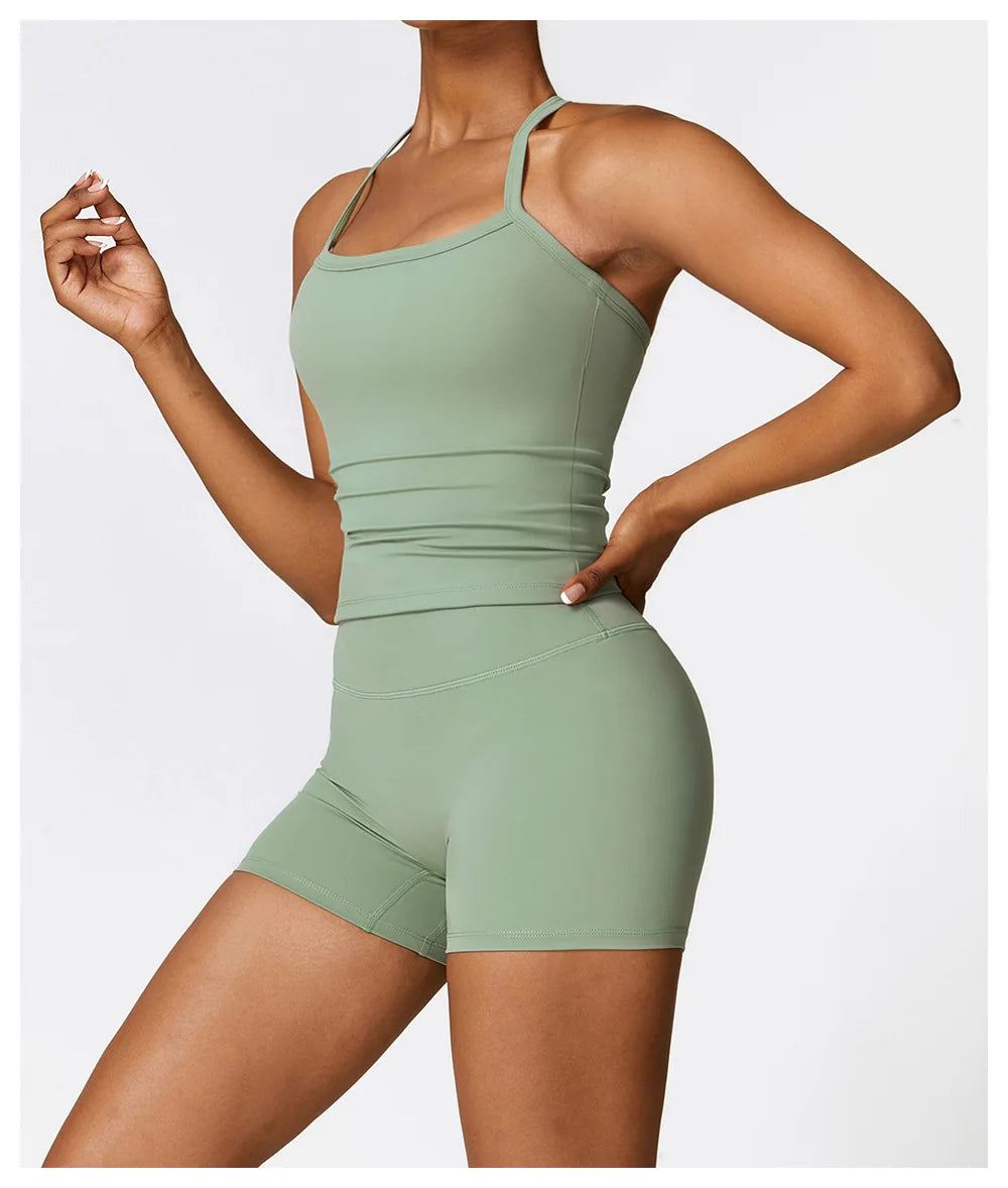 KiKis breathable gym workout bra for women in light green worn with matching shorts