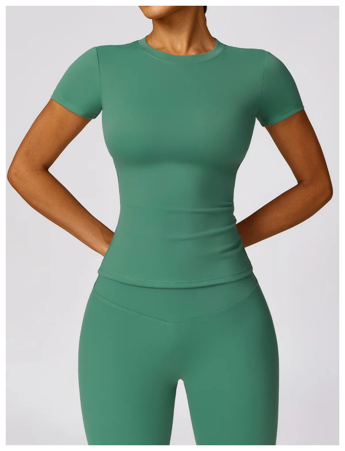 Green seamless yoga top for women by KiKis with short sleeves and fitted design for activewear