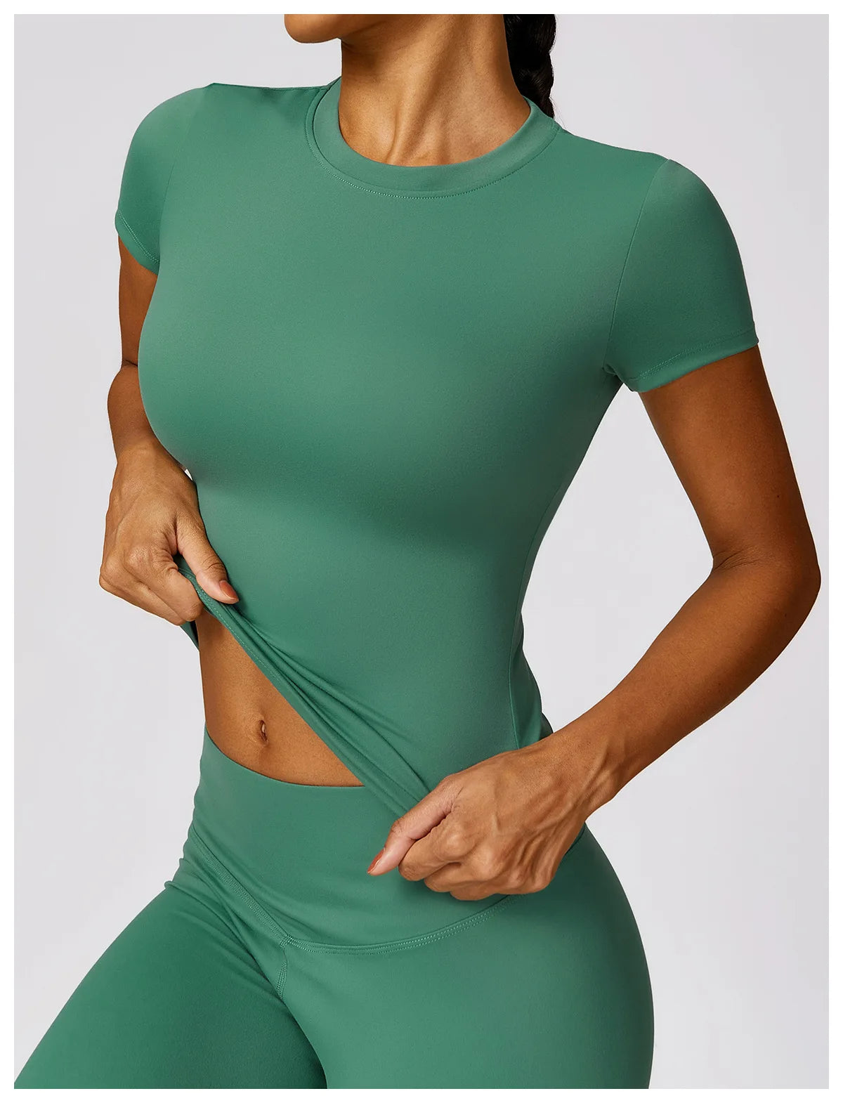 Green seamless yoga top for women by KiKis with short sleeves and fitted design
