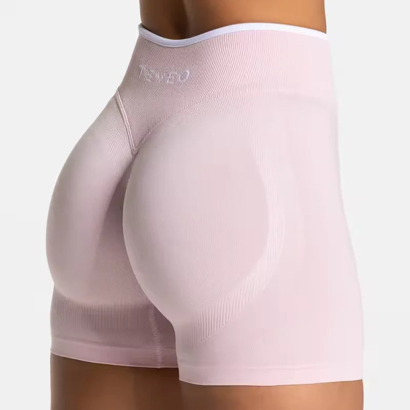 Light pink women's seamless high waist gym shorts with contour shaping and soft fabric