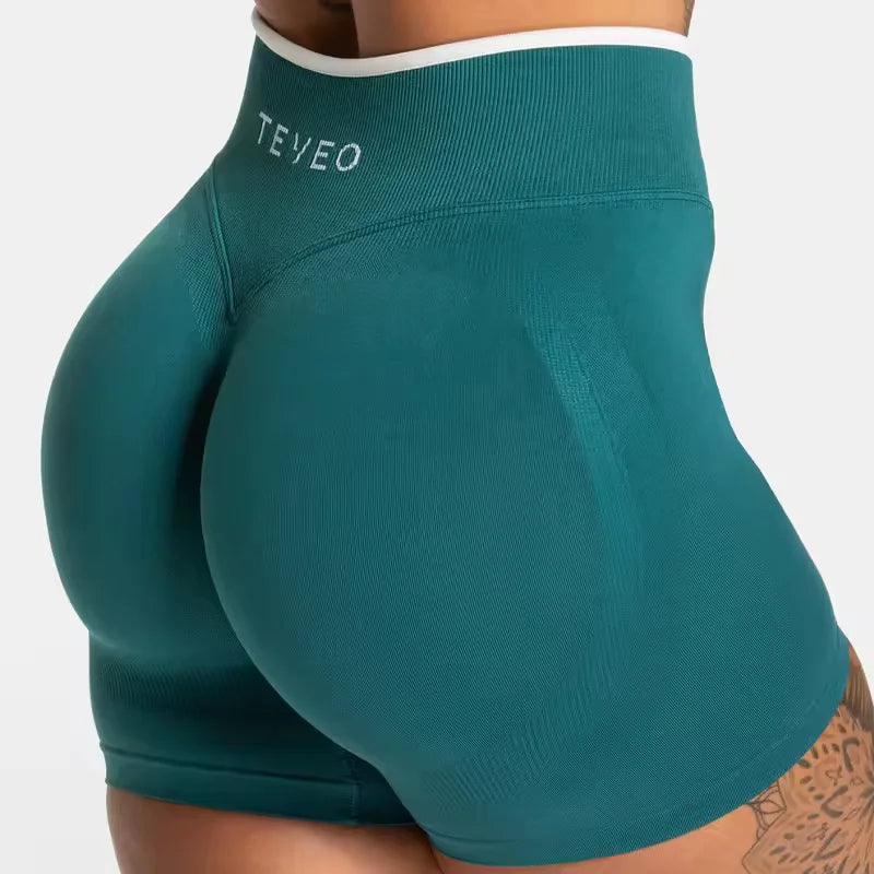 KiKis women's seamless high waist gym shorts in teal with white trim and supportive fit