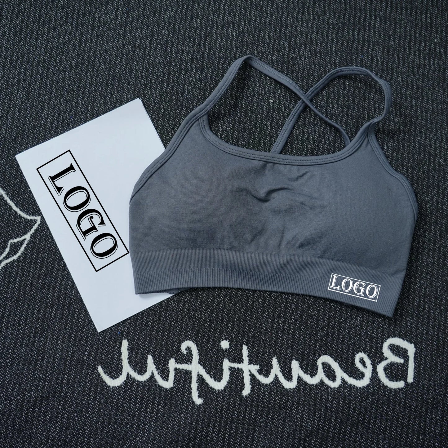 KiKis women's seamless sports bra in dark gray with thin crossed straps and soft fabric