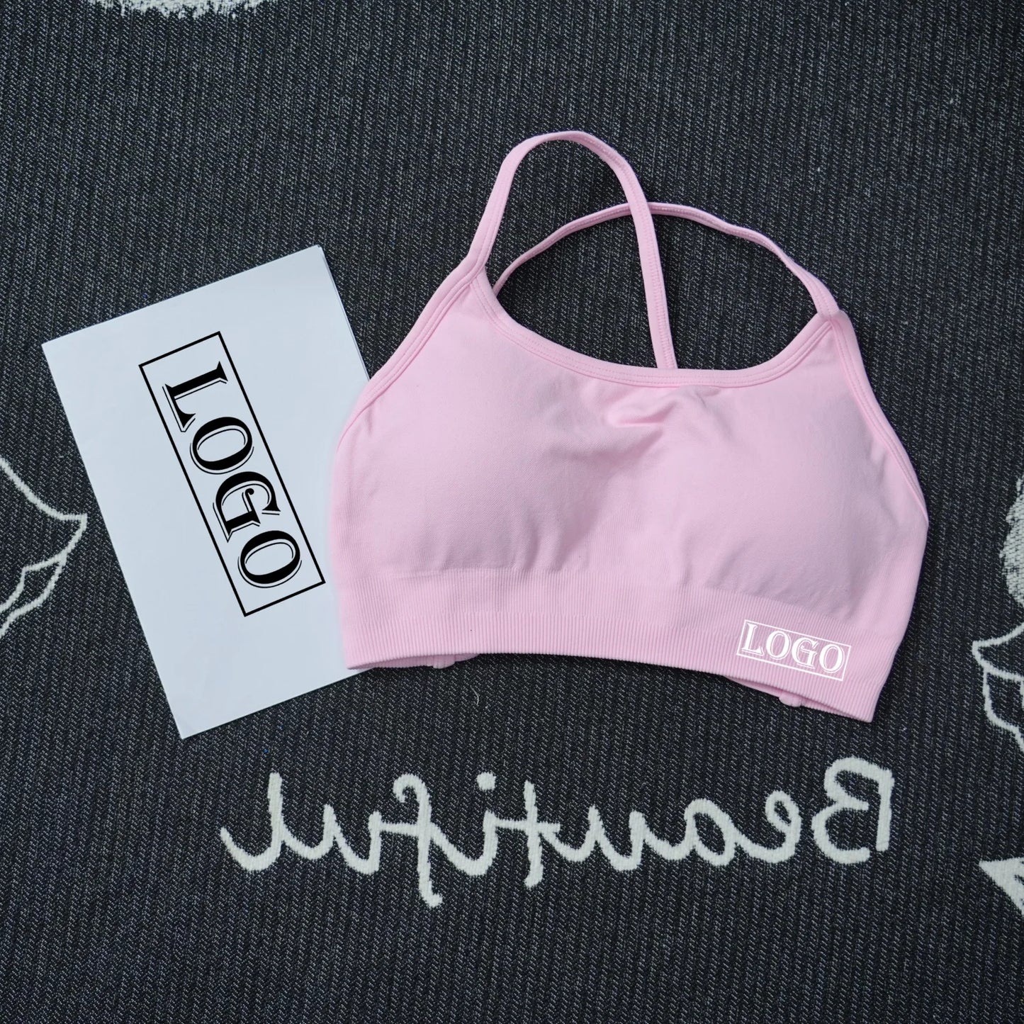KiKis women's seamless sports bra in pink with a crisscross back design for comfortable workout support