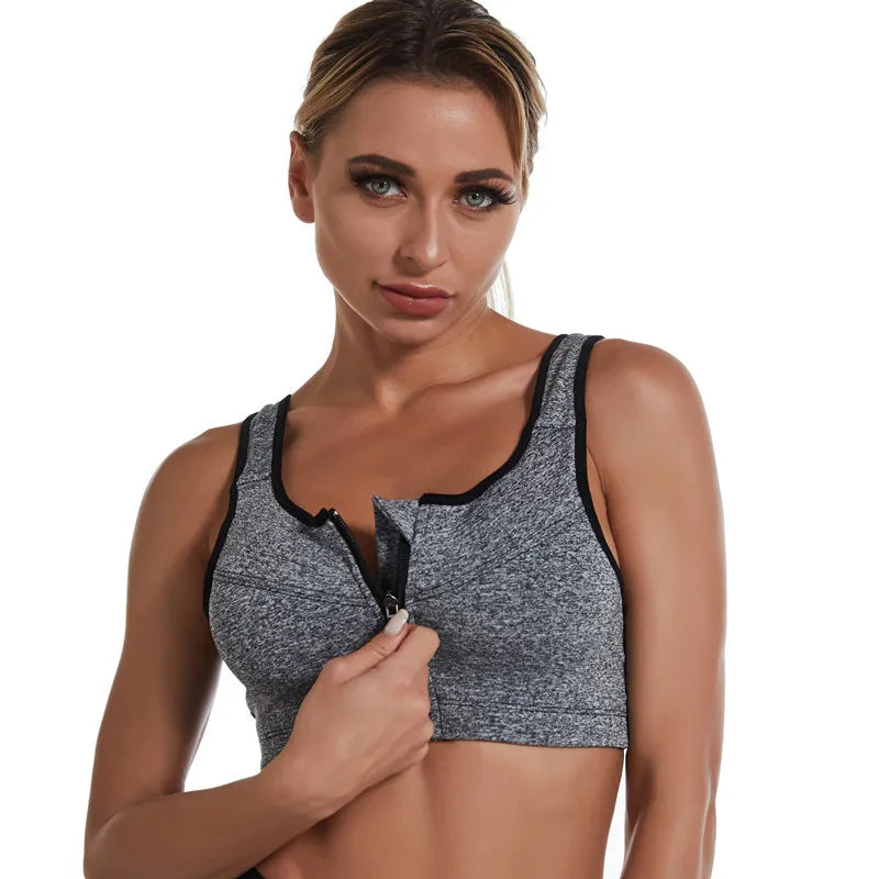 KiKis gray zipper sports bra for women with black trim worn by woman with front zipper partially open