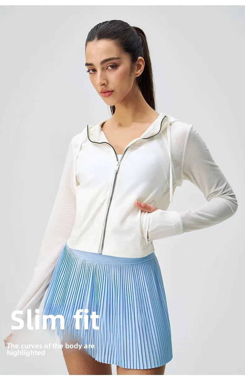 KiKis breathable yoga clothes for women featuring a slim fit white zip-up hoodie and light blue pleated skirt