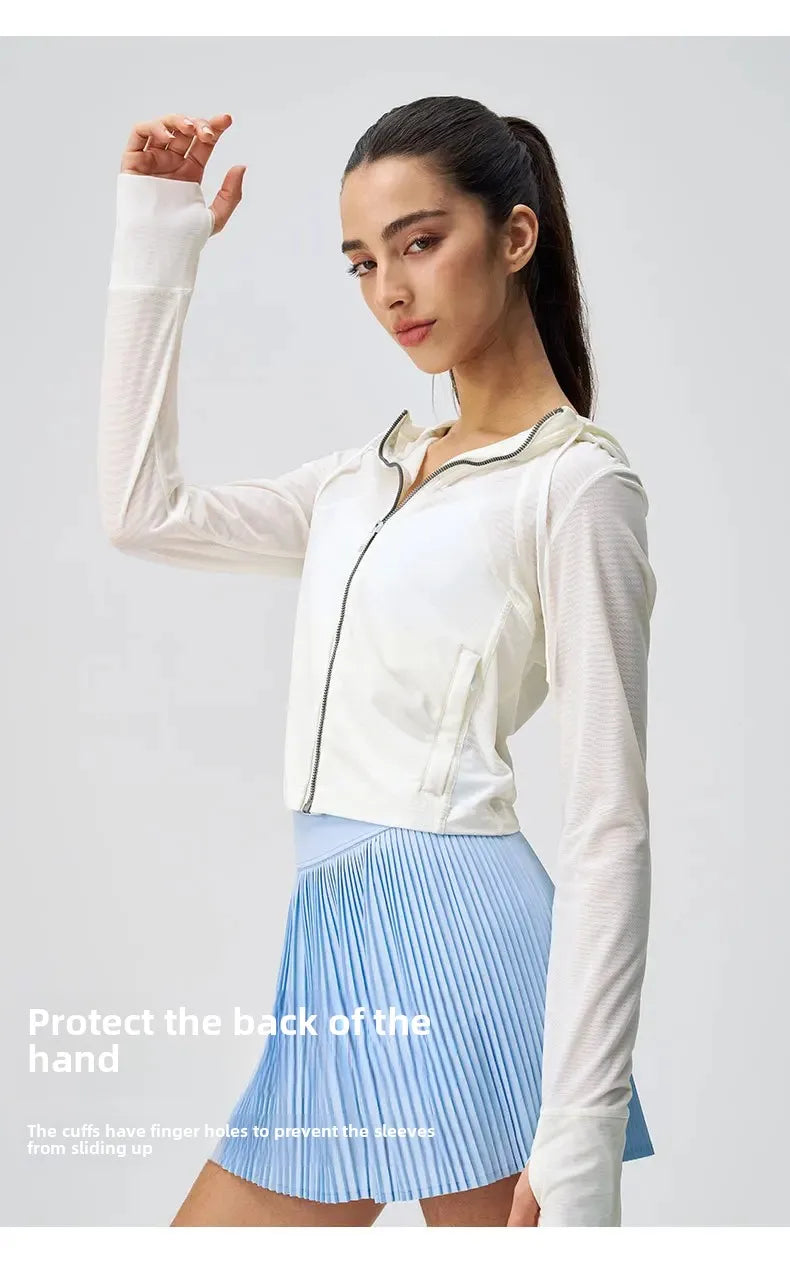 KiKis breathable yoga clothes for women featuring a white zip-up jacket with thumb holes and a light blue pleated skirt