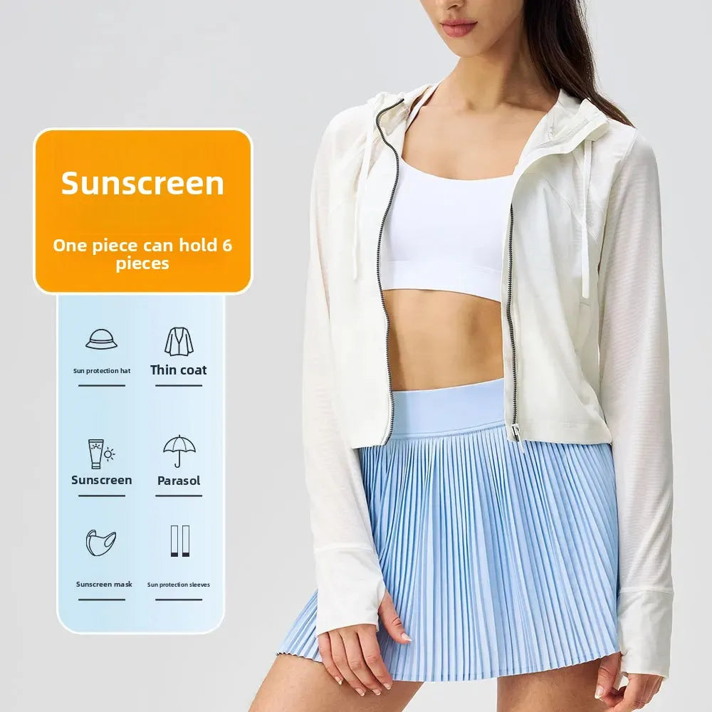 Breathable yoga clothes for women featuring a white sports bra and lightweight zip-up hoodie paired with a blue pleated skirt