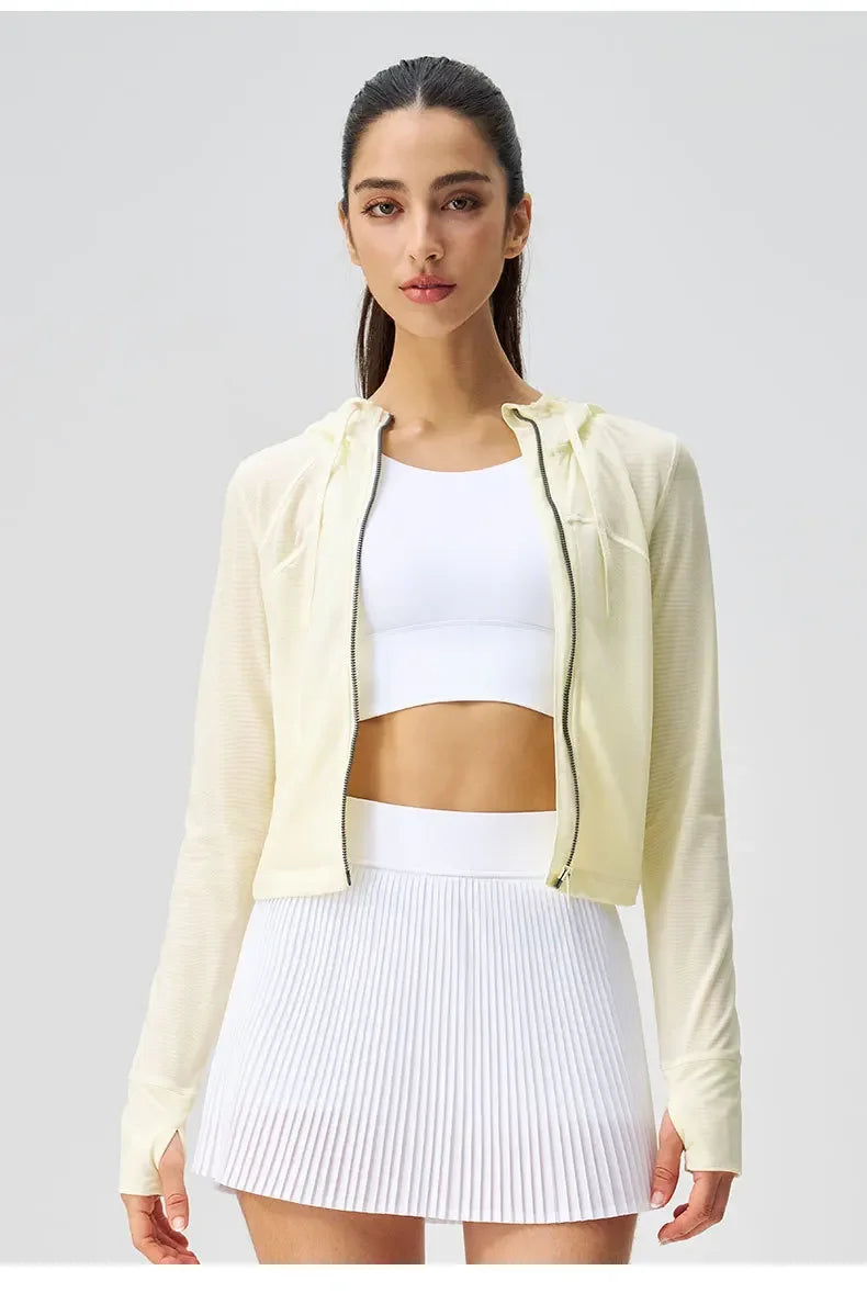 KiKis breathable yoga clothes for women featuring a white sports bra, light jacket, and pleated skirt