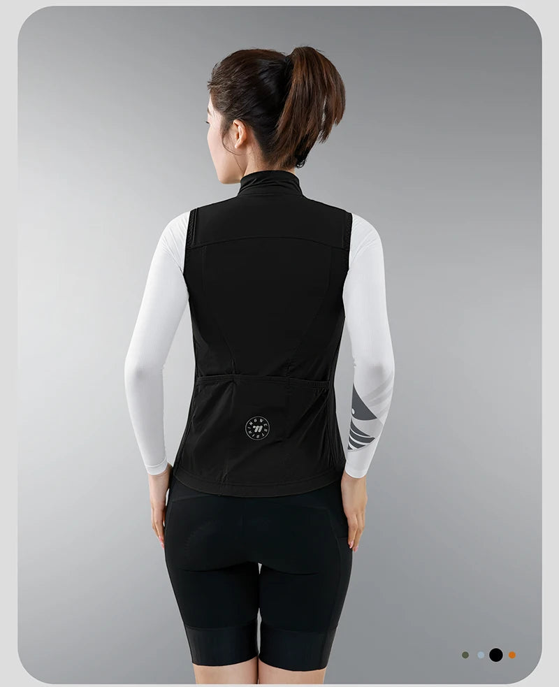 KiKis women's cycling vest summer in black worn by model from the back with white long sleeve base layer