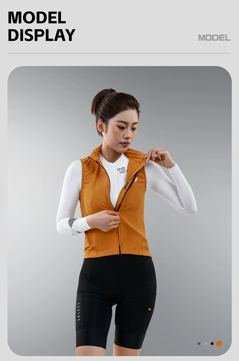 KiKis women's cycling vest summer in orange worn by a model unzipping the front for breathable comfort
