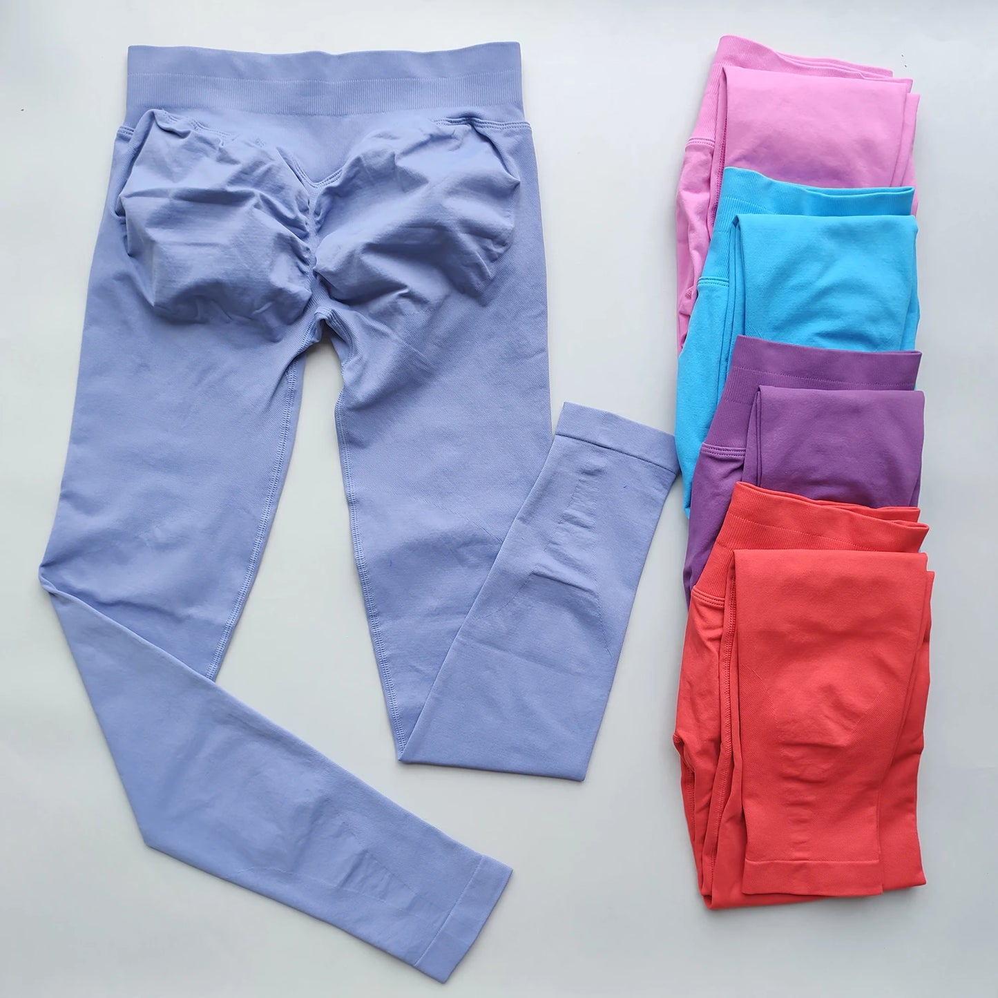 KiKis Woman Scrunch Bum Flare Leggings in multiple colors including lavender, pink, blue, purple, and red