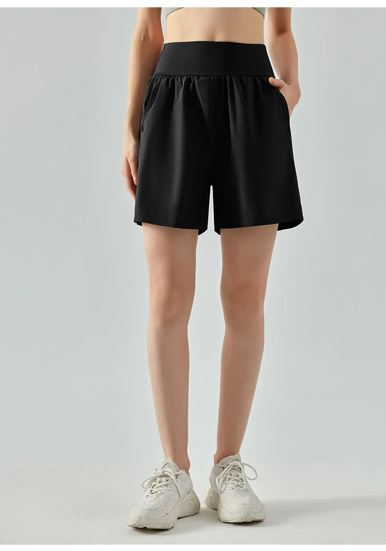 KiKis women's high waist running shorts in black with side pockets and comfortable fit