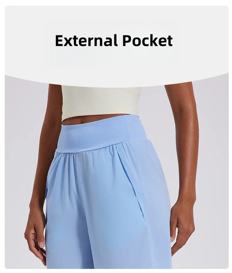 KiKis women's high waist running shorts in light blue with external pockets and comfortable fit