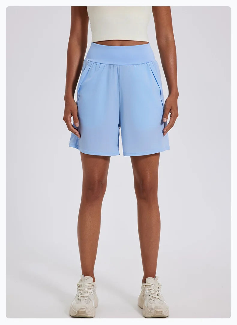 KiKis light blue women's high waist running shorts with side pockets and elastic waistband