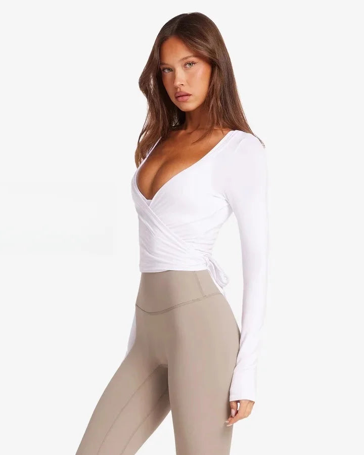Kikis women's long sleeve yoga top in white with wrap design and side tie detail
