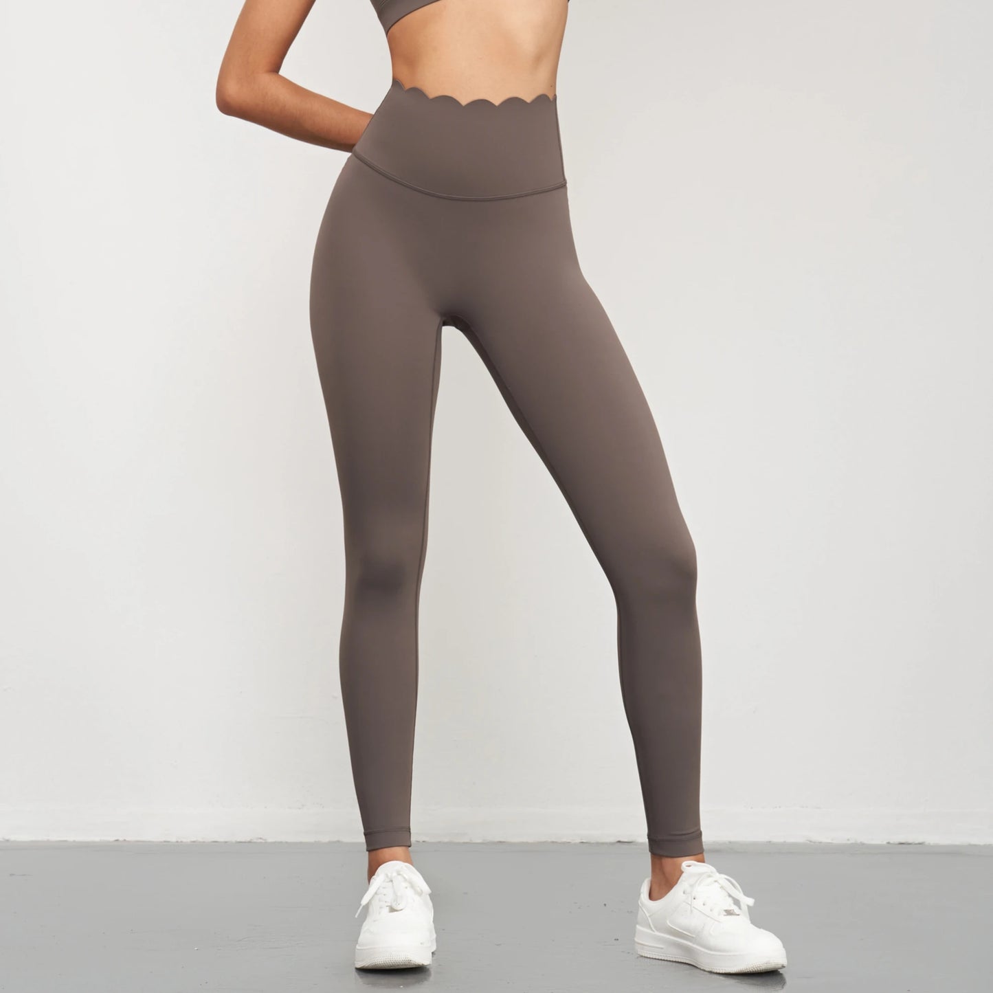 KiKis Women Seamless Lotus Arc Yoga Pants in brown with high waist and scalloped design