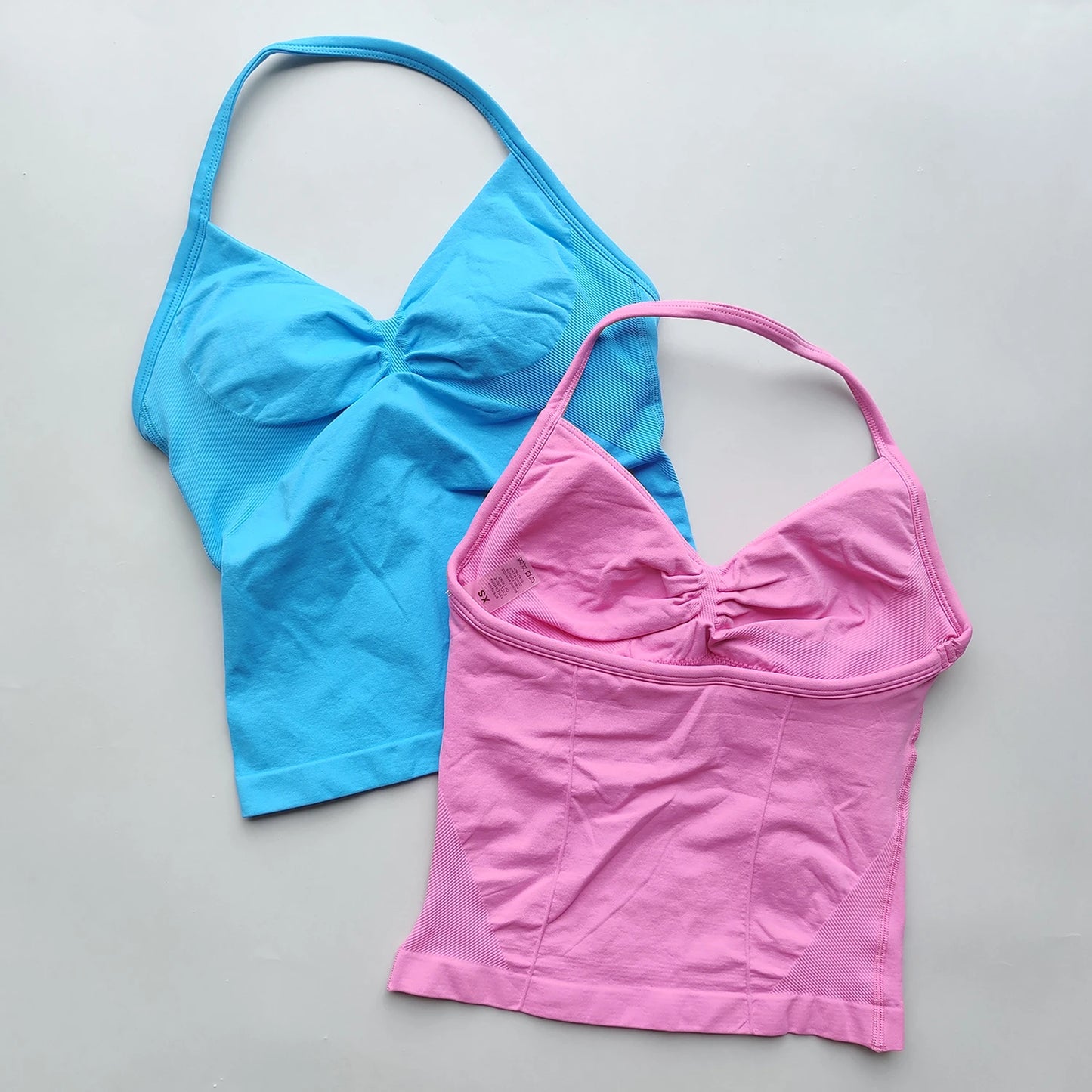 KiKis women's backless gym top in blue and pink with ruched front and adjustable straps