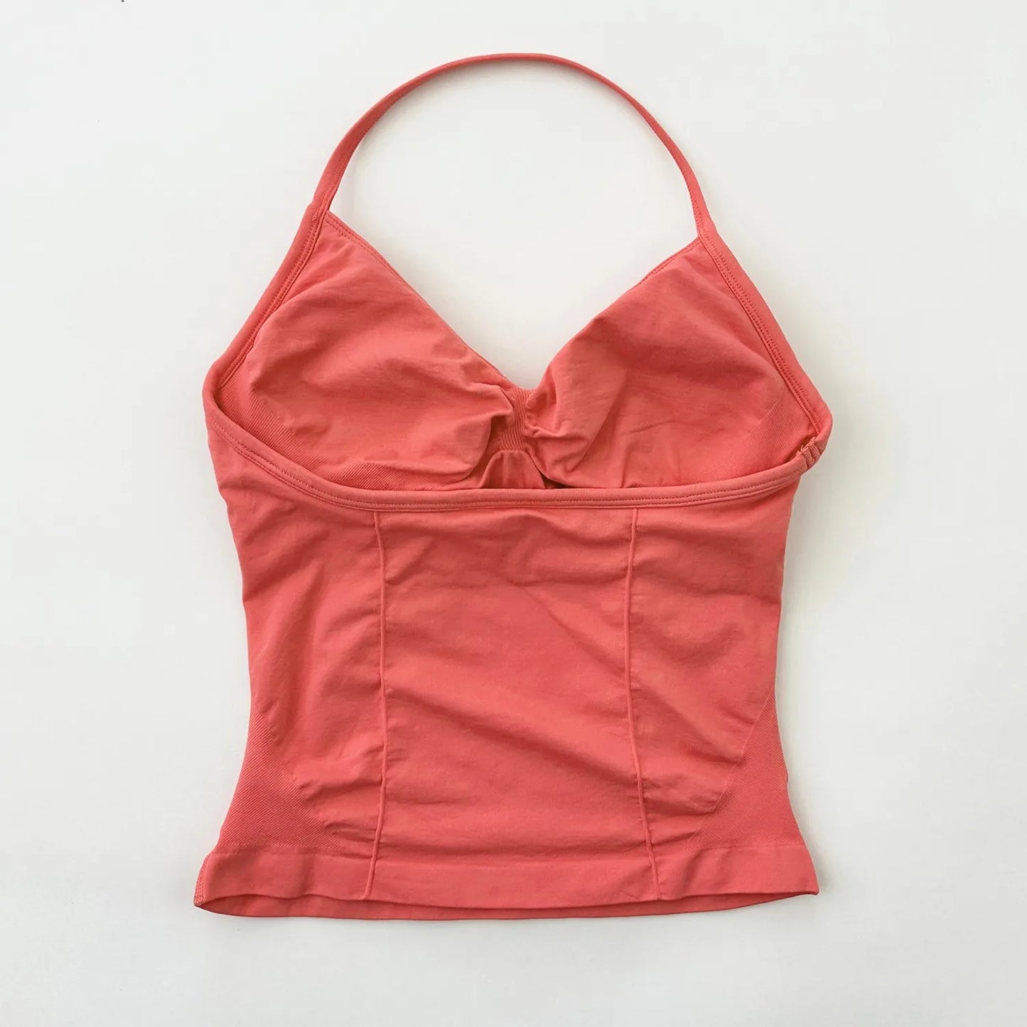 KiKis coral colored Women's Backless Gym Top with thin straps and fitted design