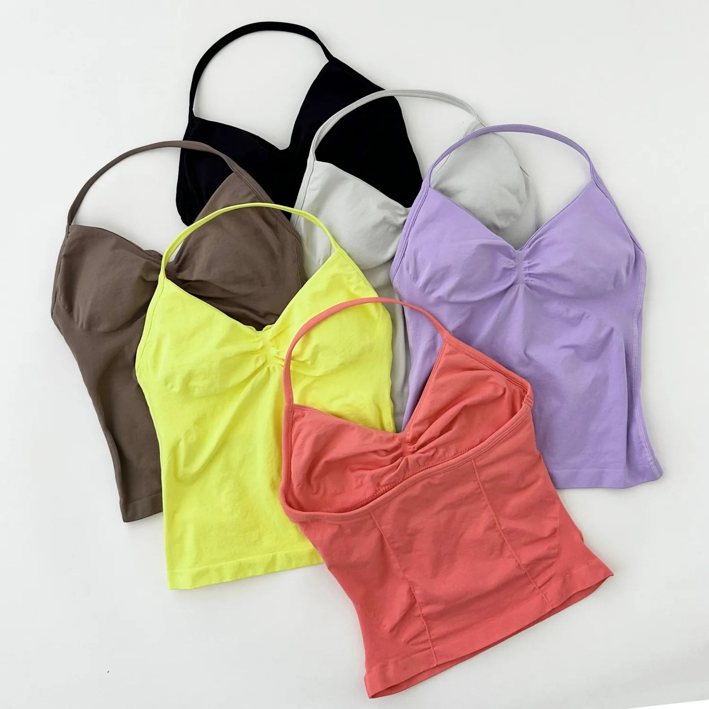 KiKis women's backless gym top in multiple colors including black, brown, yellow, coral, and lavender