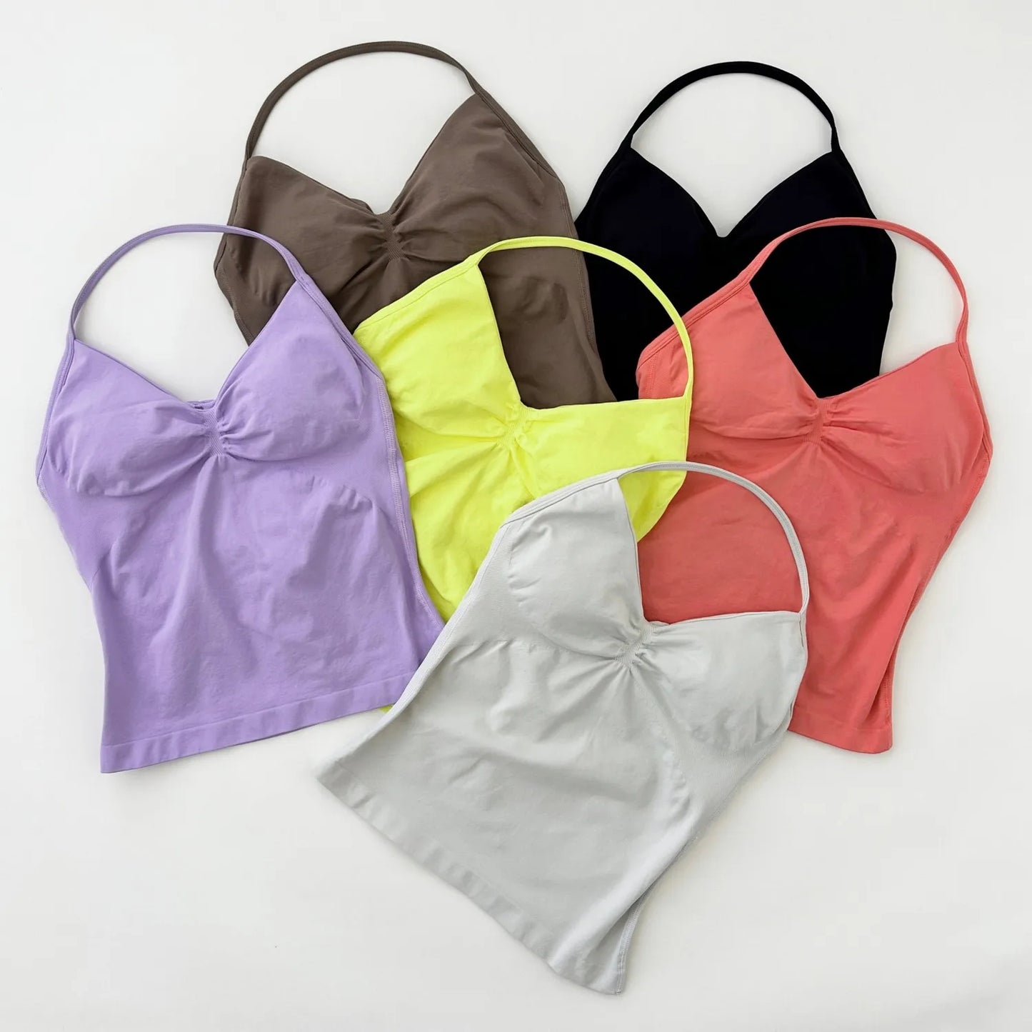 KiKis Women's Backless Gym Top collection in multiple colors including purple, yellow, black, coral, gray, and brown