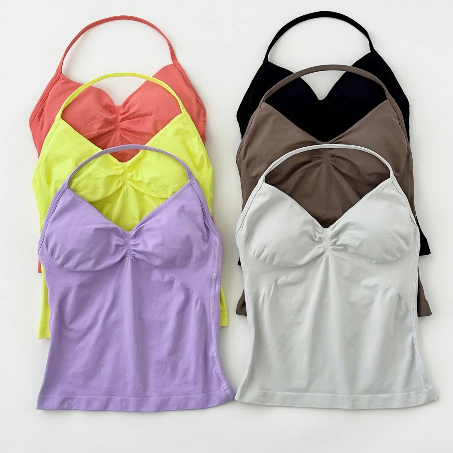 KiKis Women's Backless Gym Top in multiple colors including black, white, purple, yellow, brown, and coral