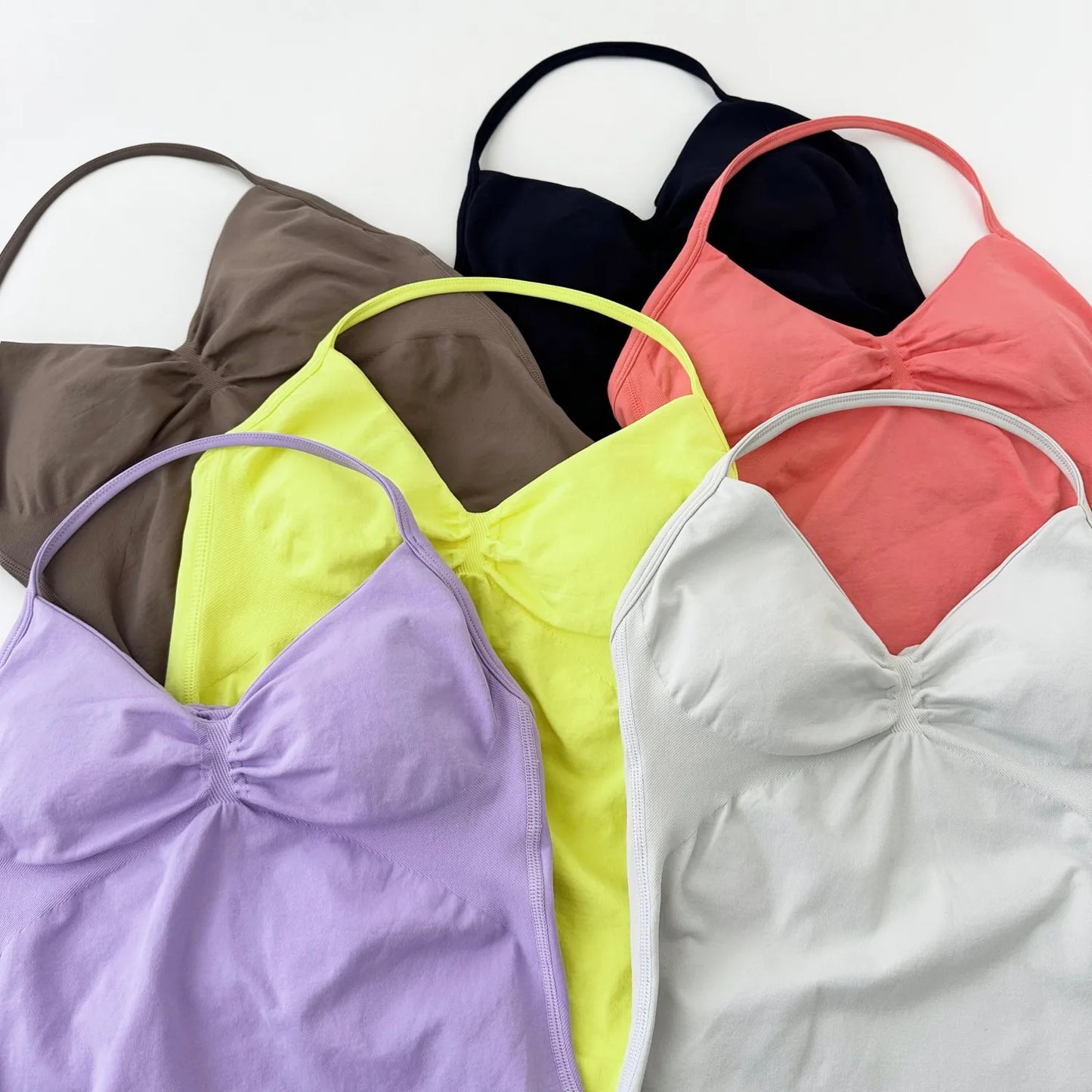 KiKis women's backless gym top in multiple colors including black, coral, yellow, brown, lavender, and white