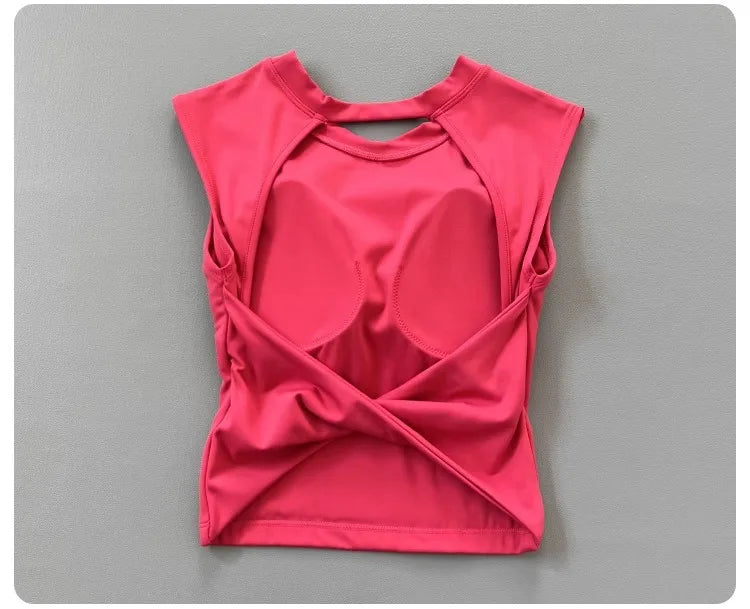 KiKis women's backless sports tank top in bright pink with unique crisscross back design