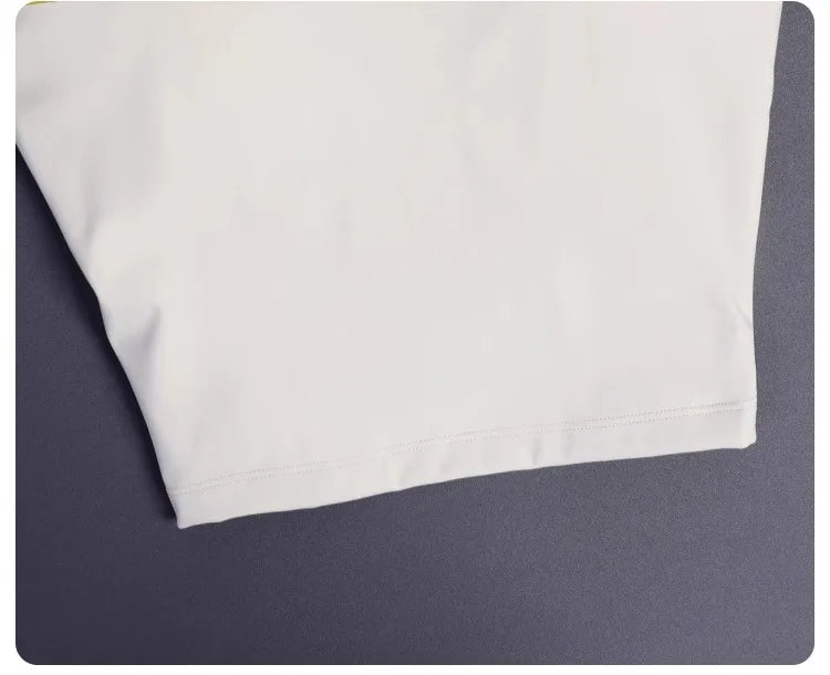 Close-up of white fabric detail on a women's backless sports tank top from KiKis