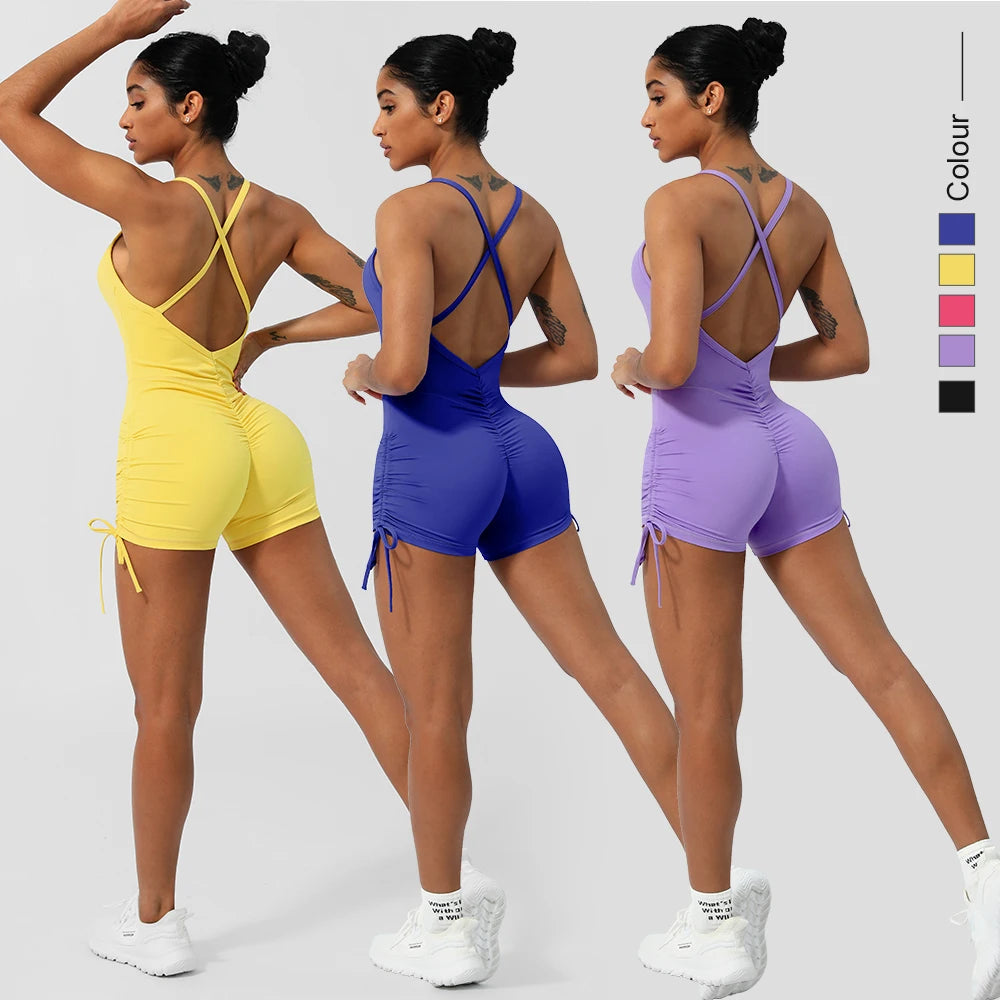 KiKis women's cross back yoga jumpsuit in yellow blue and lavender with ruched sides and white sneakers