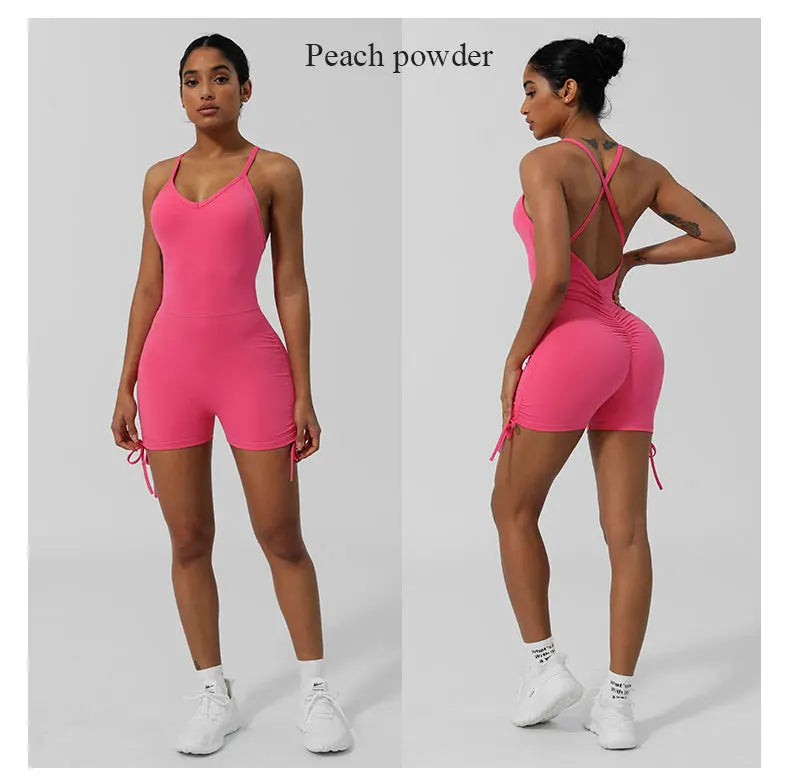 Peach powder women's cross back yoga jumpsuit in pink with adjustable straps and ruched back detail