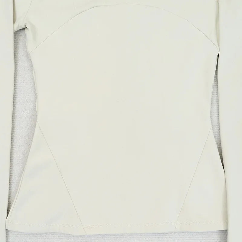 KiKis women's fleece yoga jacket in off-white color with long sleeves and fitted design