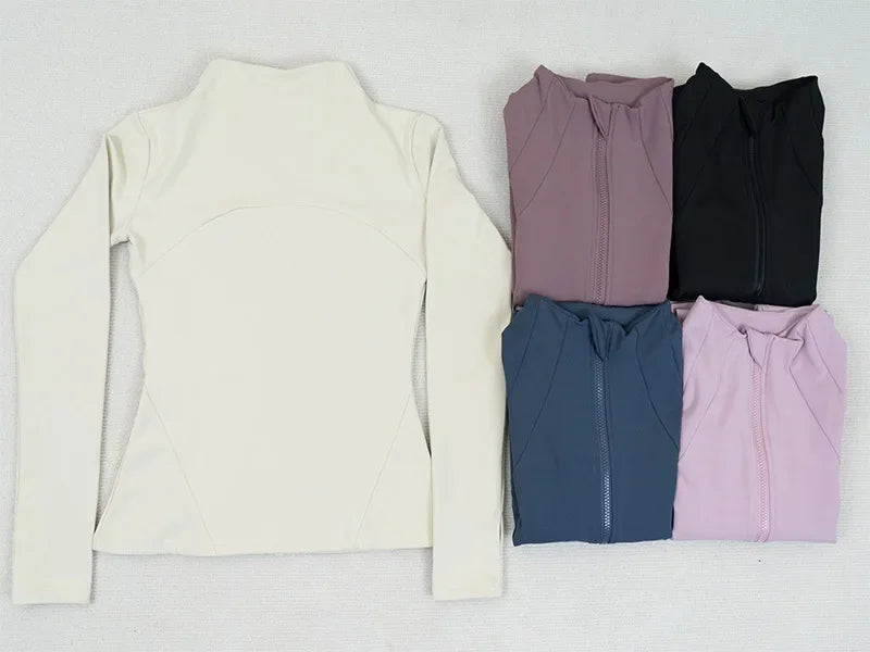 KiKis women's fleece yoga jacket collection in cream, mauve, black, navy, and pink folded and displayed