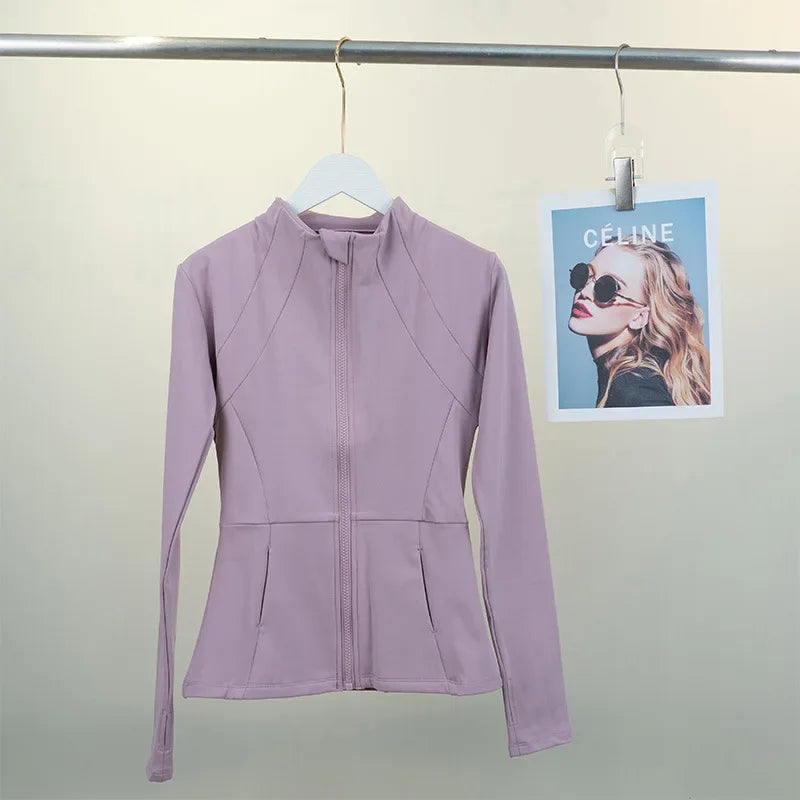 KiKis women's fleece yoga jacket in light purple with full front zipper hanging on white hanger