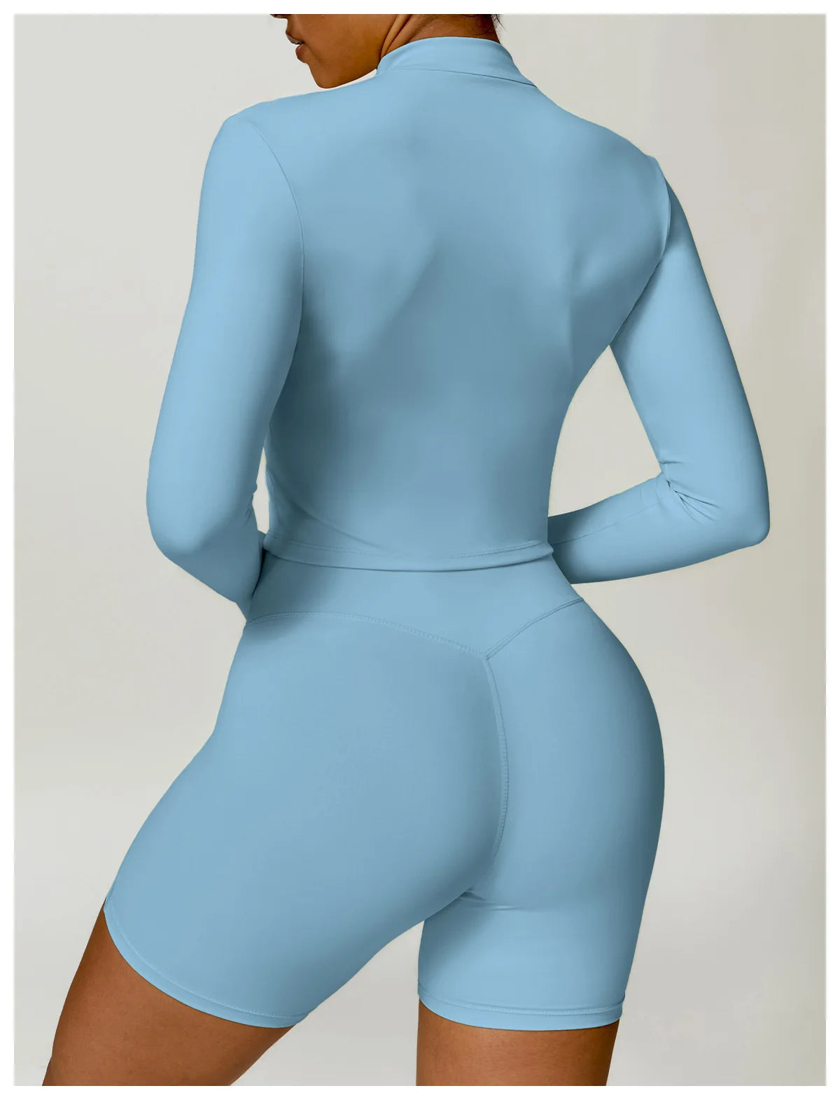 KiKis women's gym workout zip up top in light blue fitted long sleeve athletic wear