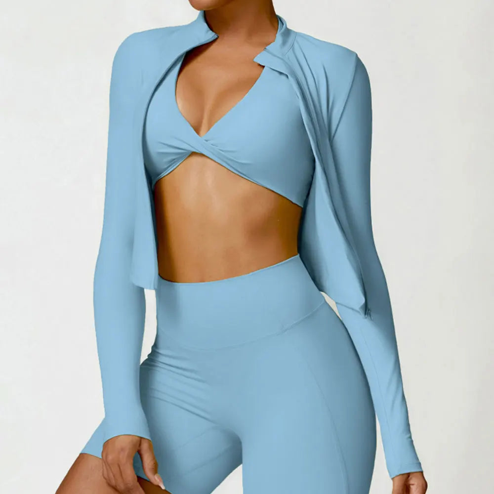 KiKis women's gym workout zip up top in light blue paired with matching high-waisted leggings