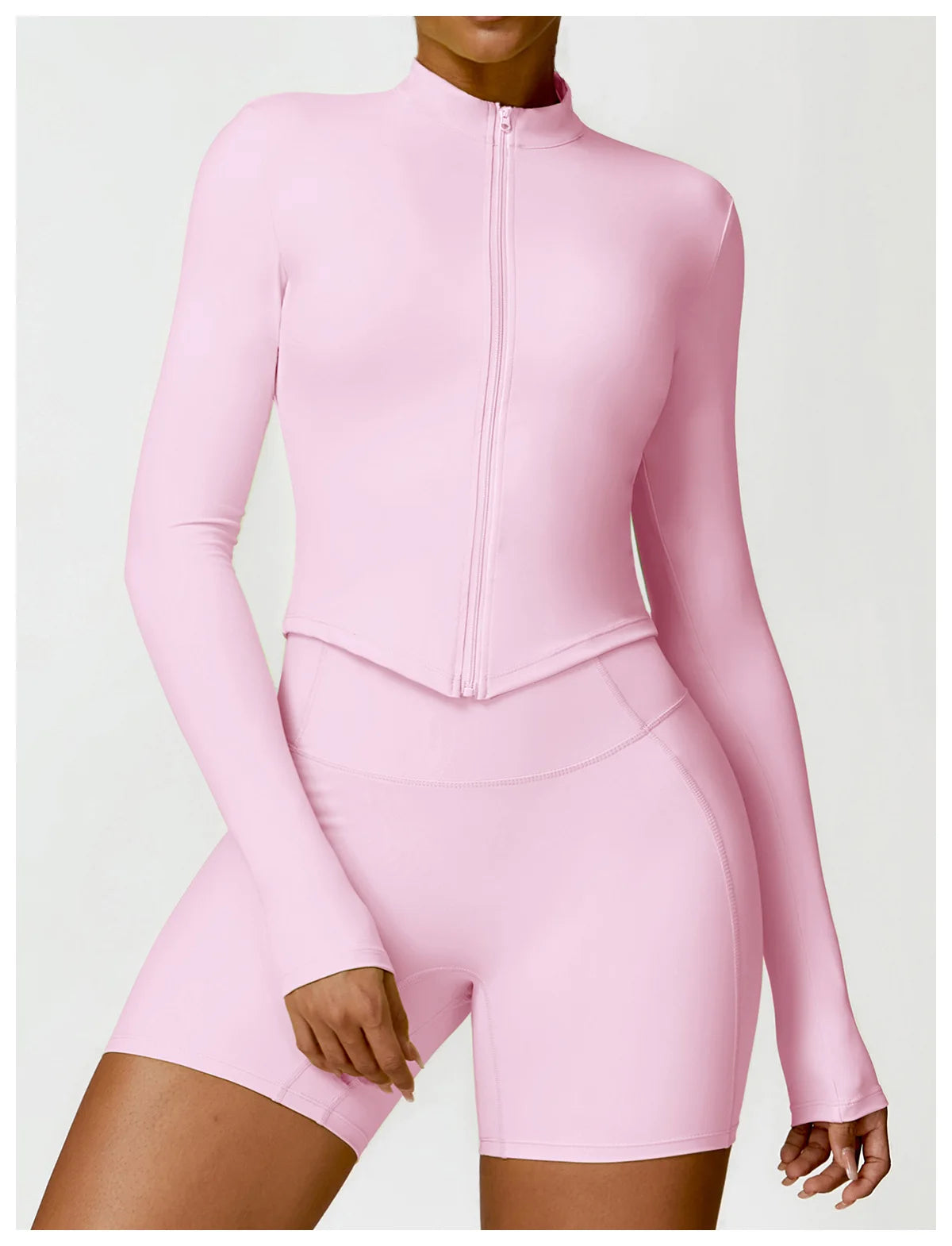 KiKis women's gym workout zip up top in pink with long sleeves and fitted design