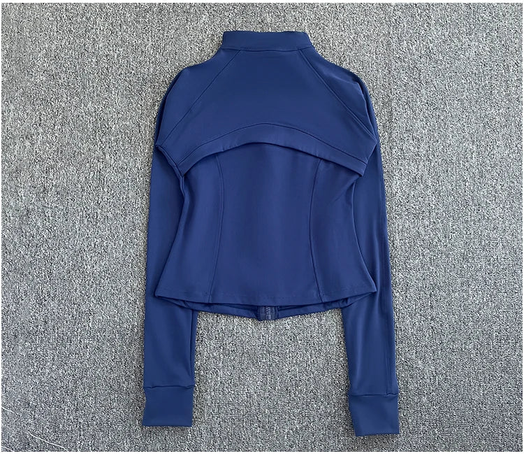 KiKis women's high-end exercise jacket in navy blue laid flat on a gray surface