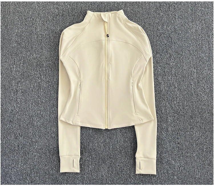 KiKis women's high-end exercise jacket in cream color with full zipper and thumb holes