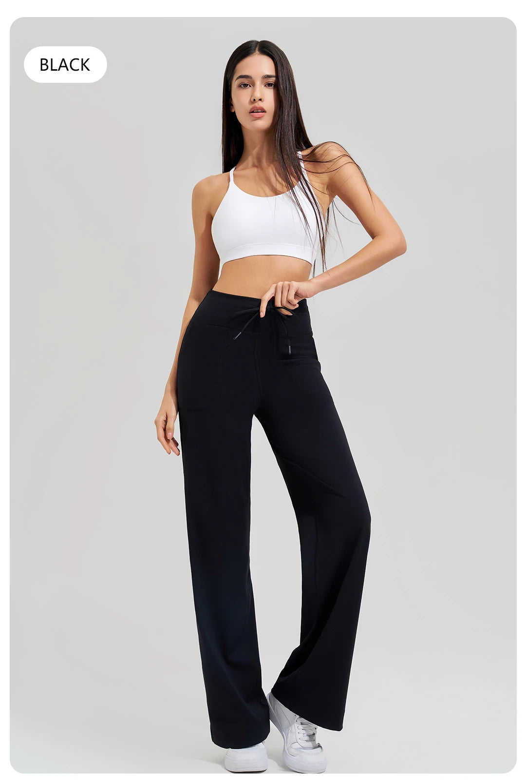 KiKis black Women's High Waist Loose Running Yoga Pants worn with white crop top and sneakers