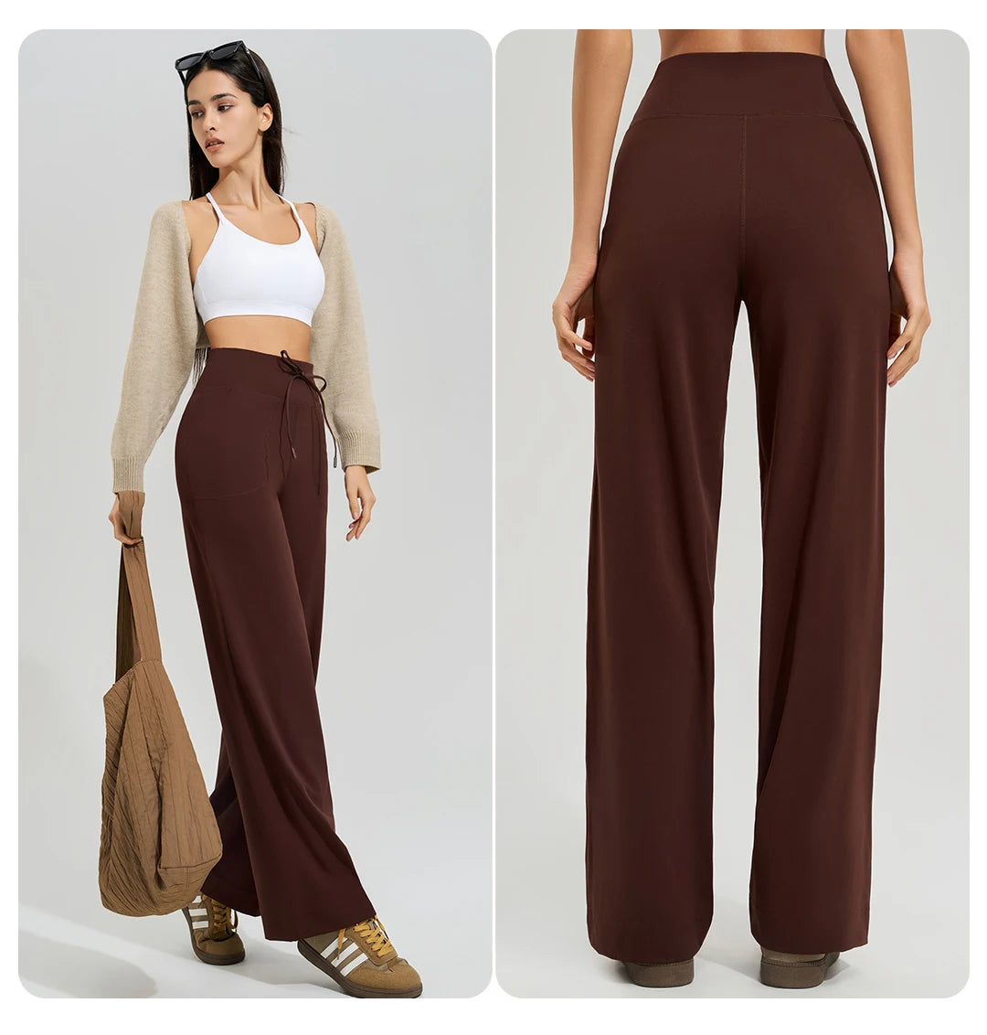 KiKis Women's High Waist Loose Running Yoga Pants in brown worn with white crop top and beige cardigan