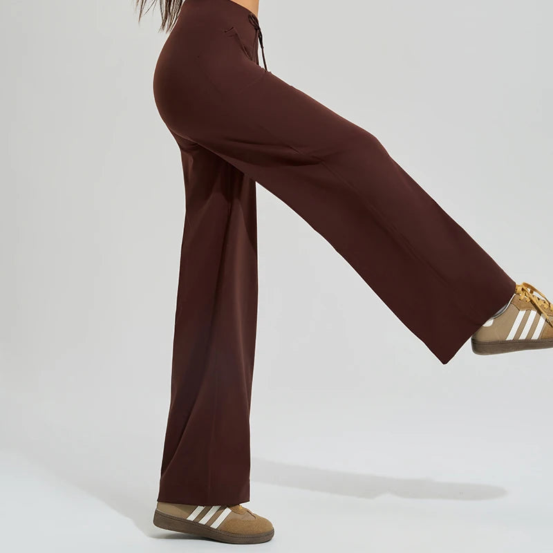 KiKis Women's High Waist Loose Running Yoga Pants in brown shown in side profile with wide leg design
