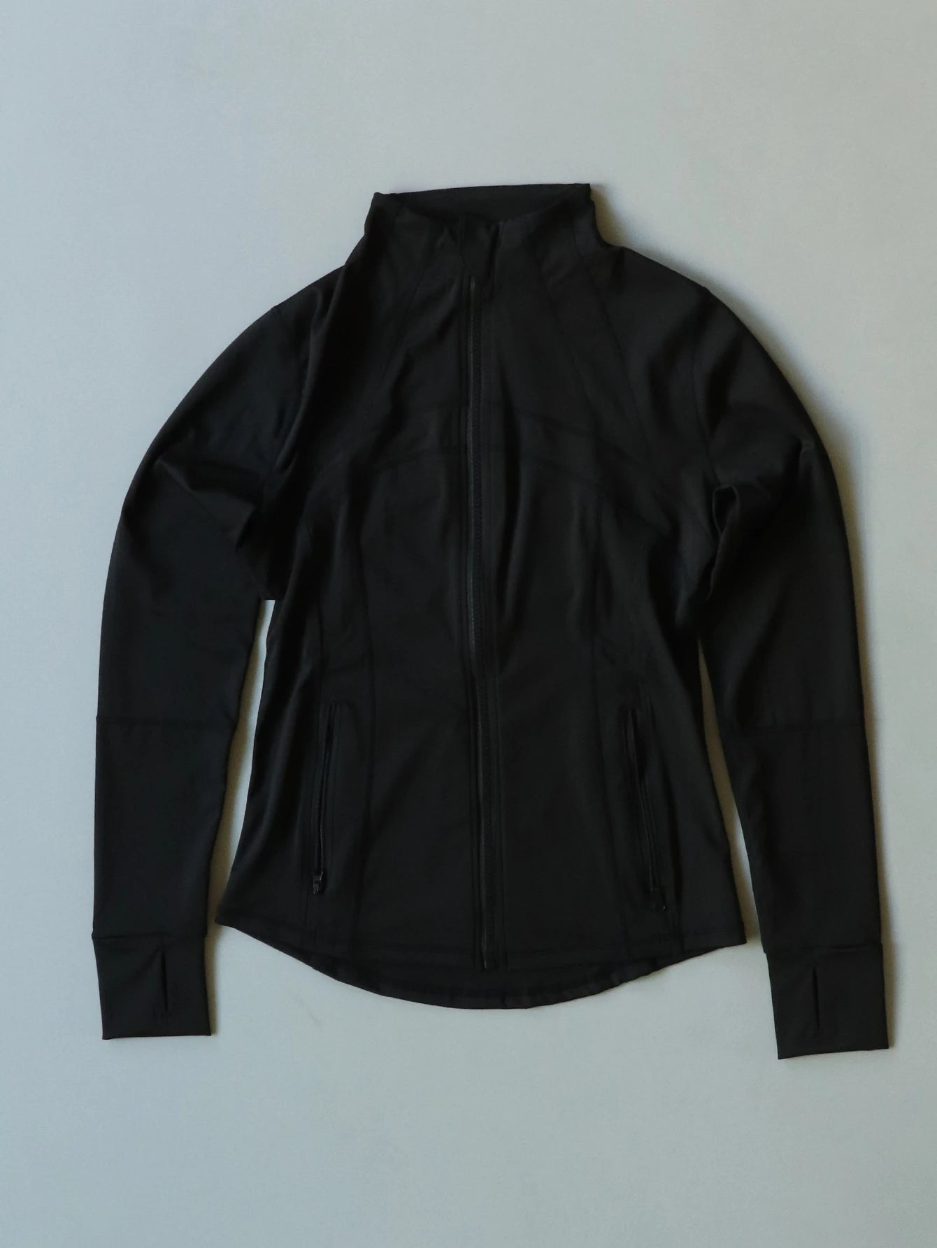 KiKis Women's Lightweight ZipUp Activewear Jacket in black with full front zipper and long sleeves