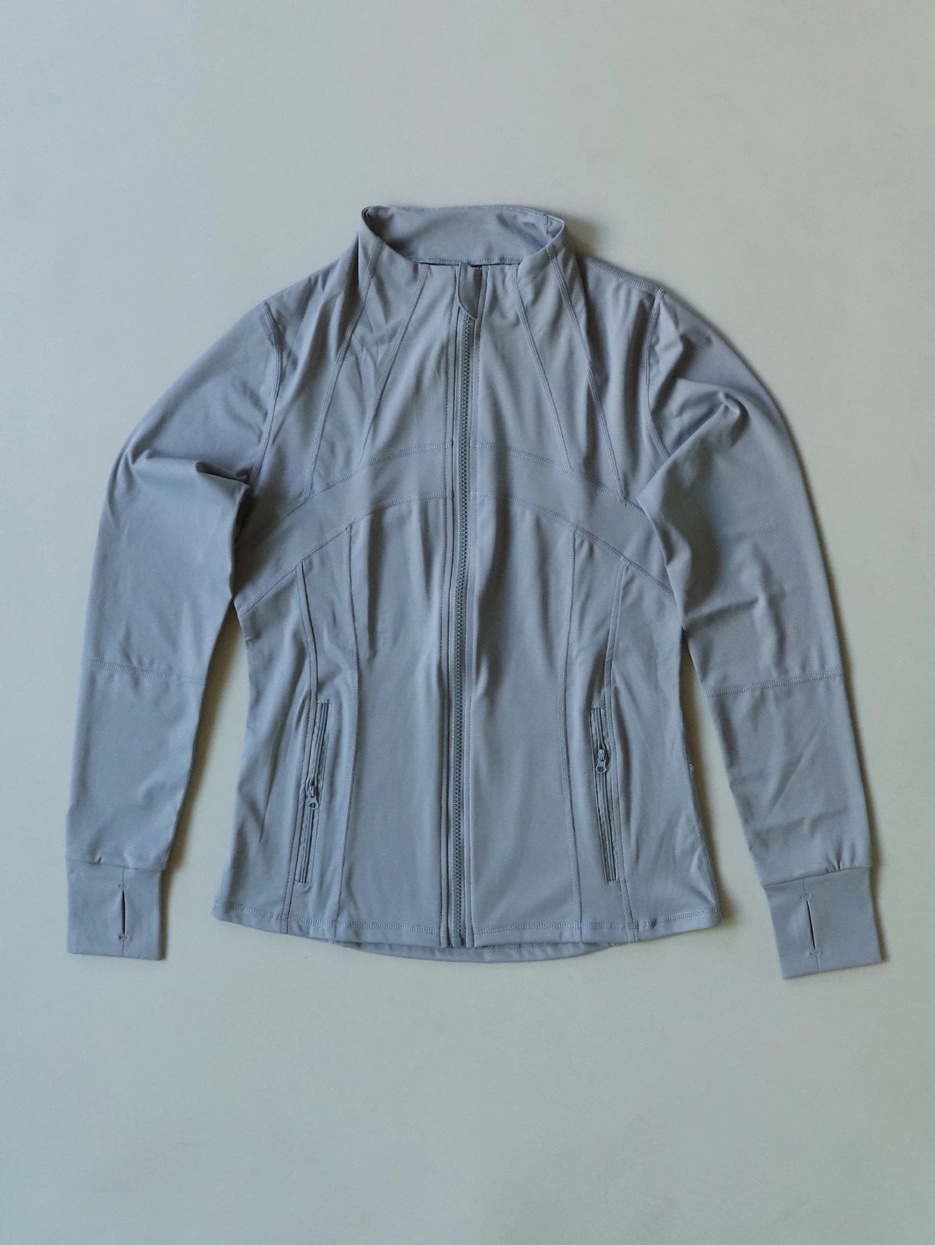 KiKis Women's Lightweight ZipUp Activewear Jacket in light gray with full front zipper and zippered pockets