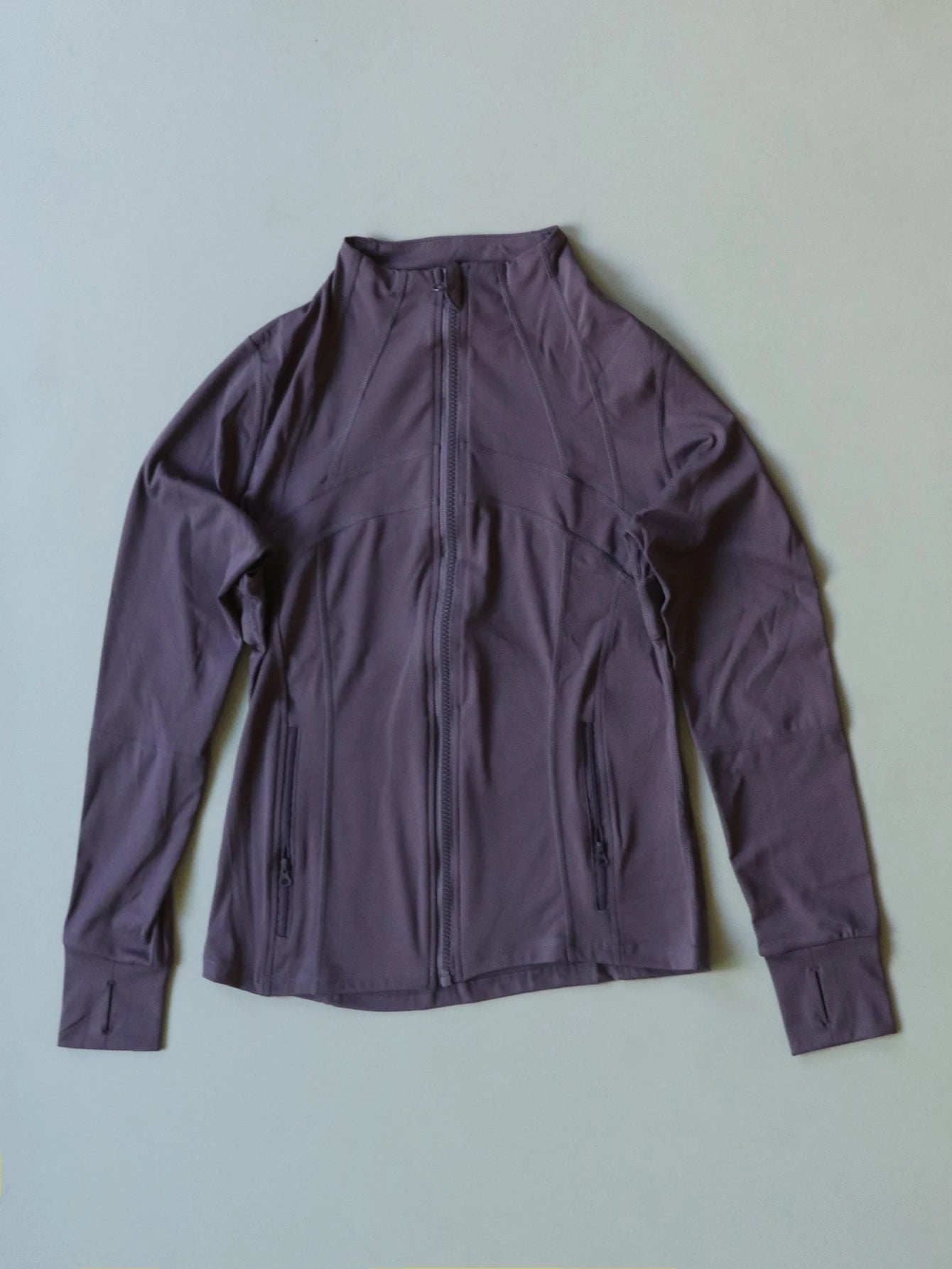 KiKis Women's Lightweight ZipUp Activewear Jacket in dark purple with full front zipper and zippered pockets
