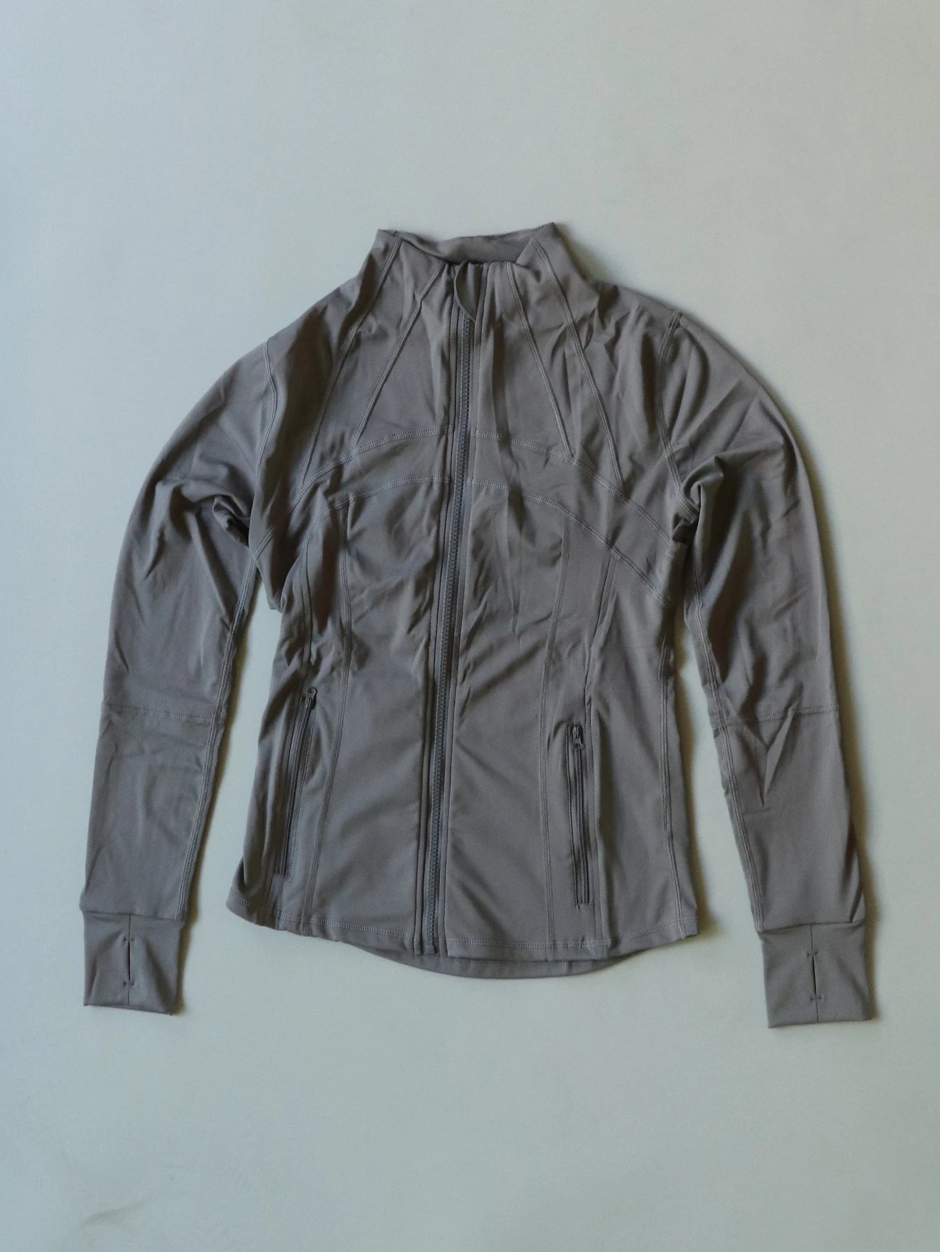 KiKis women's lightweight zipup activewear jacket in gray with long sleeves and front pockets