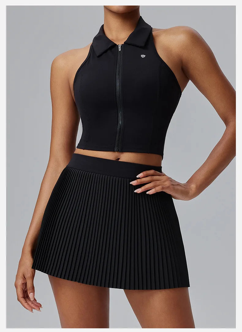 KiKis Women's Organ Pleated Tennis Skirt in black with high waistband and pleated design