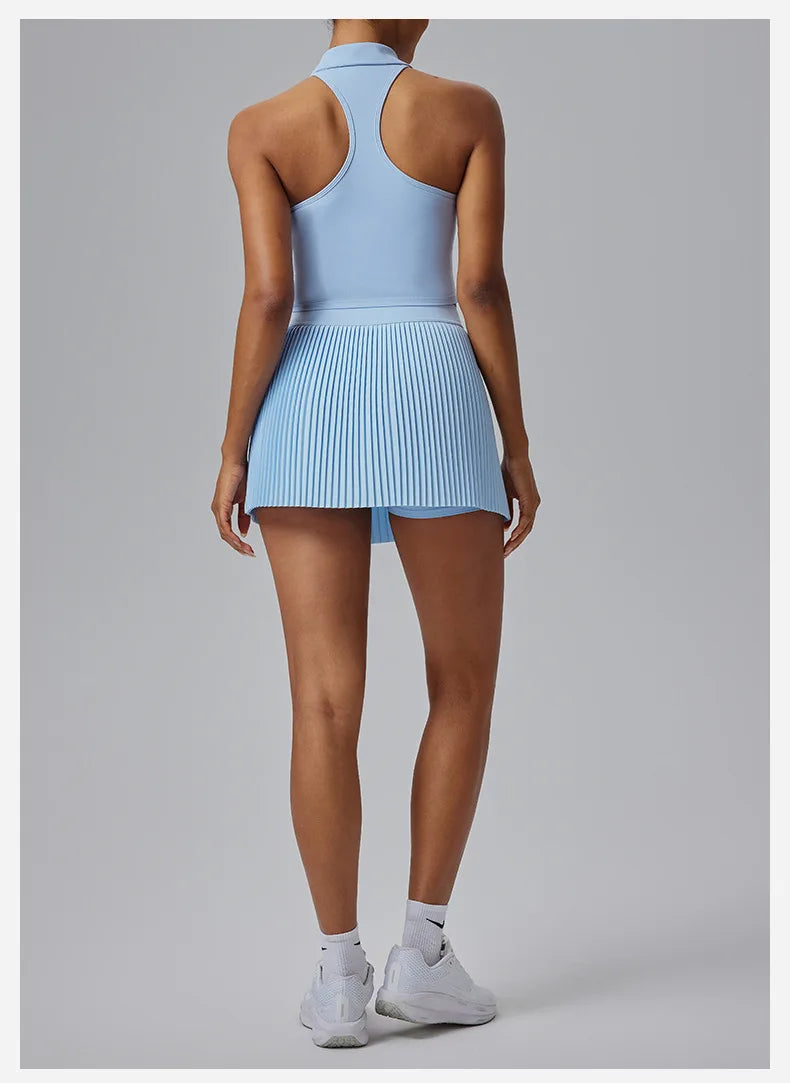 Back view of a woman wearing a light blue Women's Organ Pleated Tennis Skirt by KiKis with white sneakers